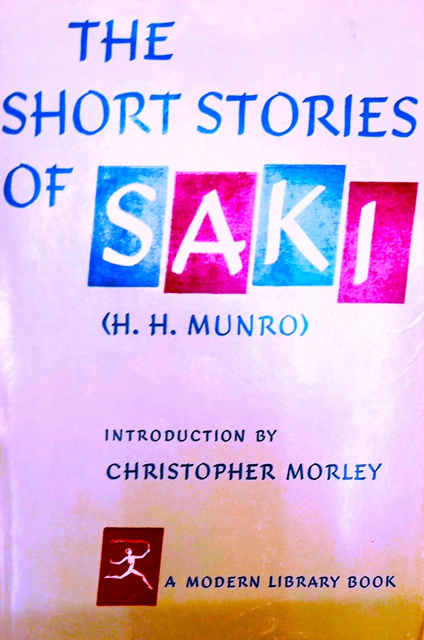 Book cover of 'The Short Stories of Saki' by H.H. Munro with colorful text design.