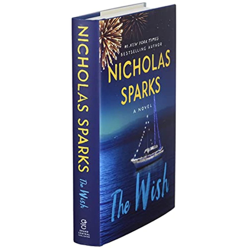 front cover angled view of the book 'The Wish' by Nicholas Sparks, featuring a nighttime scene with fireworks and a boat on the water.
