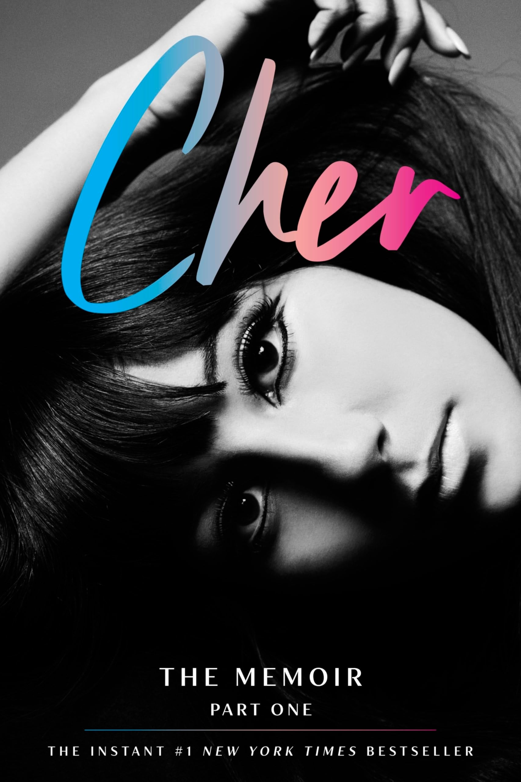 Book cover of 'Cher: The Memoir Part One' with a black and white photo of Cher and colorful text.