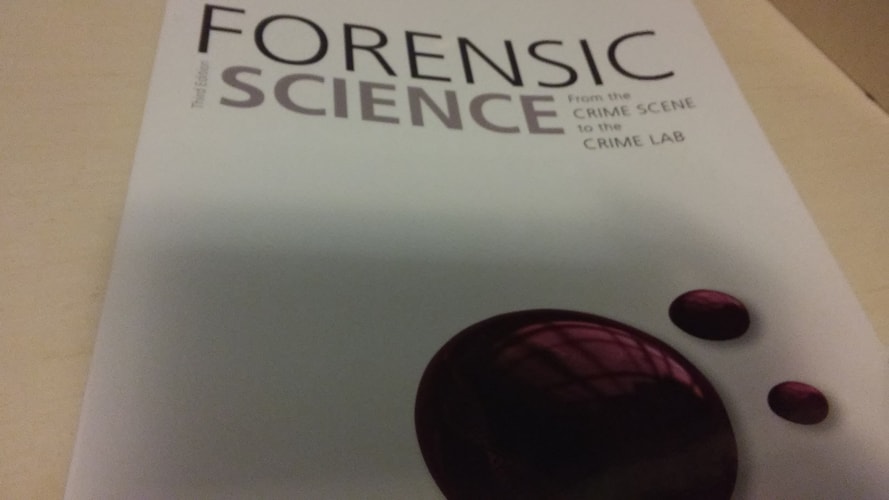 Book cover of 'Forensic Science' with a dark red stain on a light background