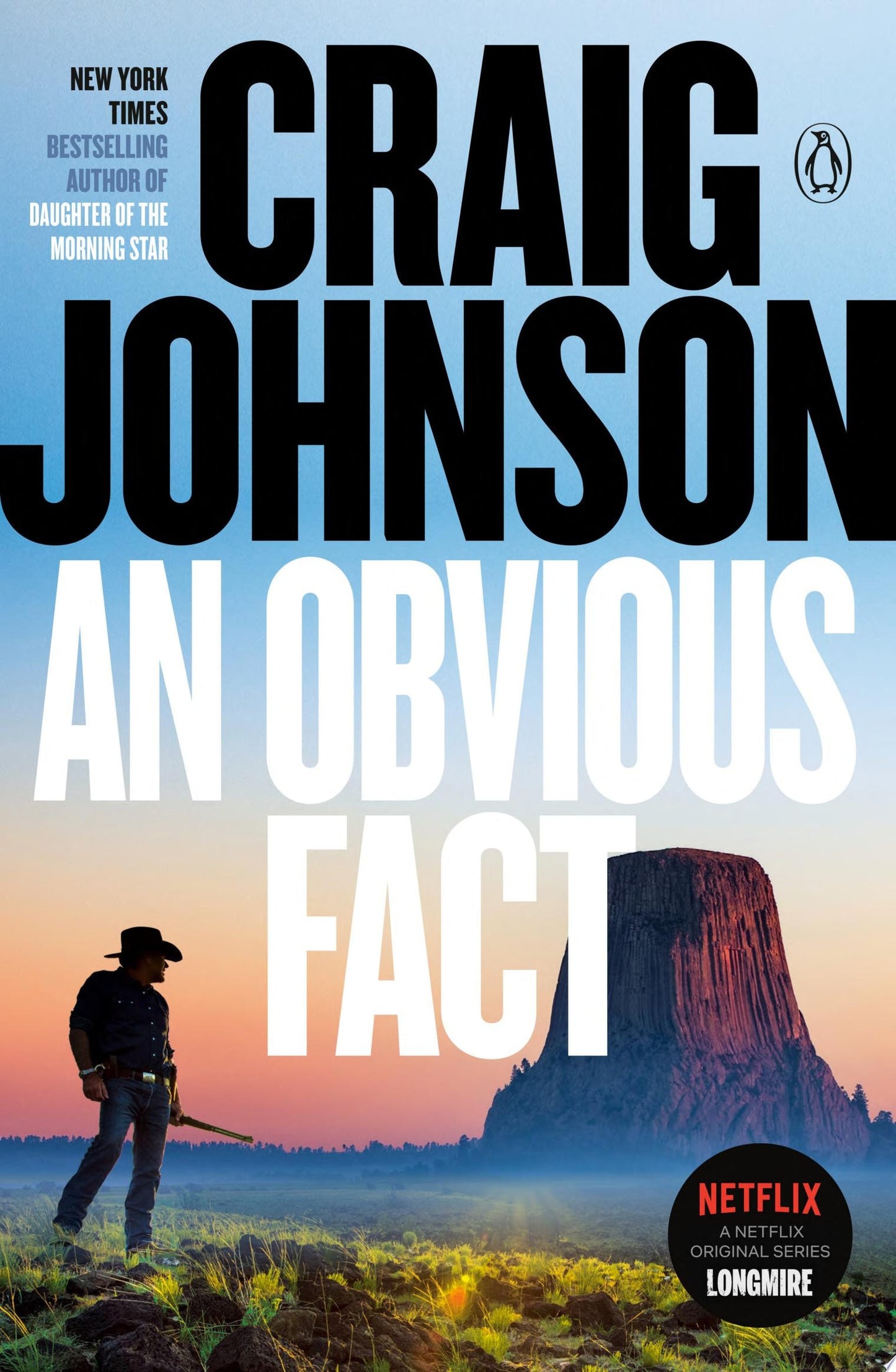 Book cover of 'An Obvious Fact' by Craig Johnson with a silhouette of a man and a mountain.