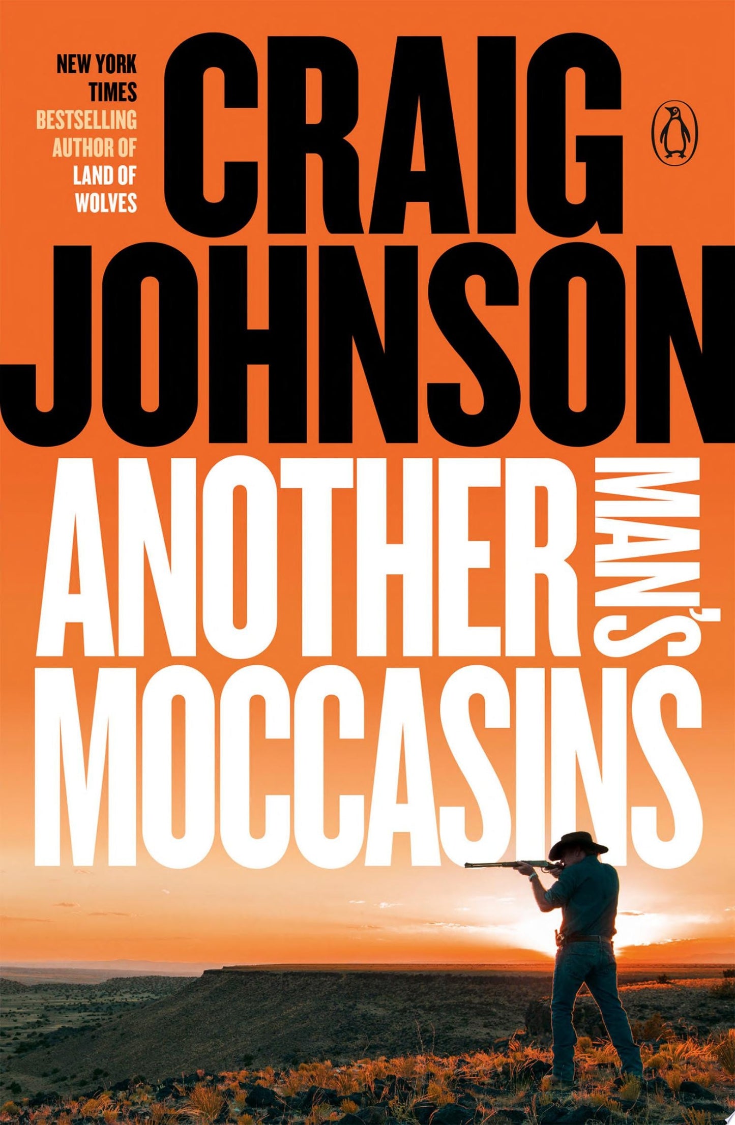 Book cover of 'Another Man's Moccasins' by Craig Johnson with a silhouette of a person holding a rifle against an orange sky.
