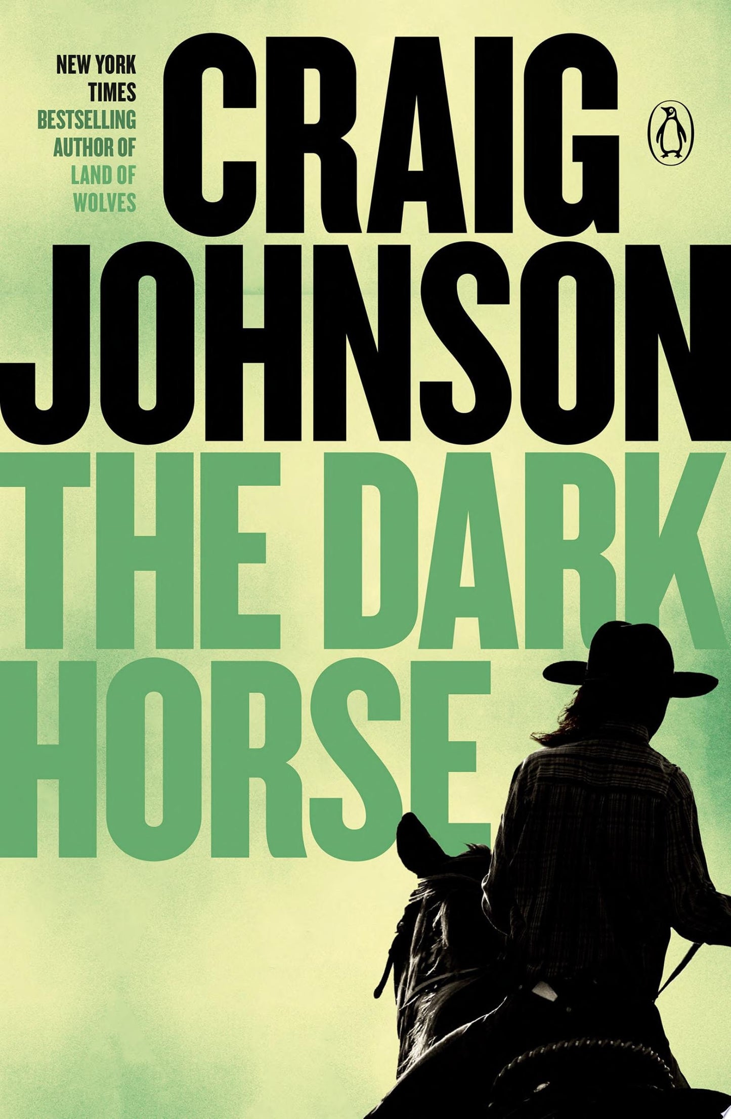 Book cover of 'The Dark Horse' by Craig Johnson with a silhouette of a person on a horse.