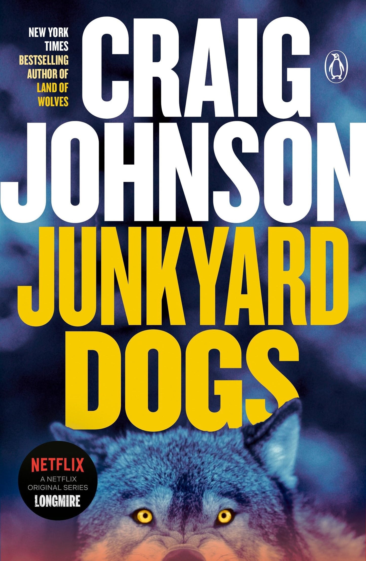 Book cover of 'Junkyard Dogs' by Craig Johnson with a wolf illustration.