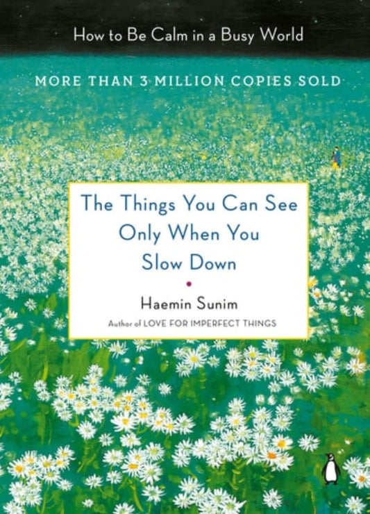 Book cover of 'The Things You Can See Only When You Slow Down: How to Be Calm in a Busy World' by Haemin Sunim, featuring text on a background of a field of flowers.