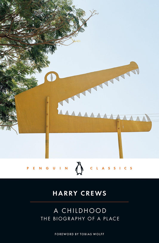 Book cover of 'A Childhood' by Harry Crews with a yellow alligator sculpture against a blue sky.