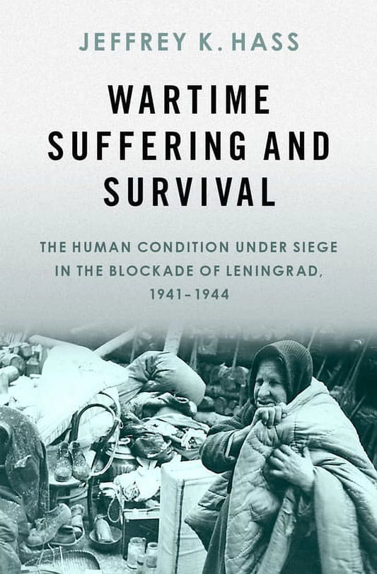 Book cover of 'Wartime Suffering and Survival' by Jeffrey K. Hass, featuring a black and white photograph of a person in distressed condition.