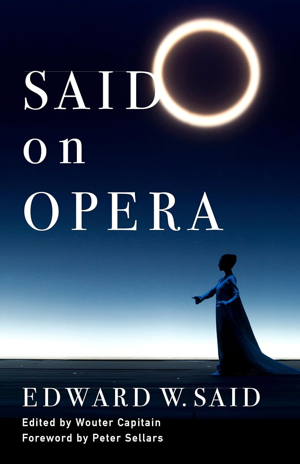Book front cover of 'Said on Opera' by Edward W. Said, edited by Wouter Capitain. The paperback book features a minimalist dark teal design with crisp white serif typography. The bottom half displays a vintage, sepia-toned archival photograph of a grand 19th-century opera house interior, showing ornate gold balconies and the massive stage. Published by Columbia University Press. ISBN 9780231212014. A definitive collection of essays on music, politics, and culture.