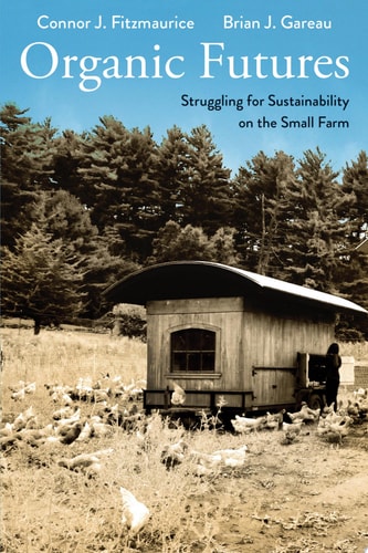 Book cover of 'Organic Futures' with a small wooden shed and chickens in a field.