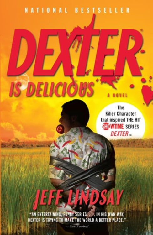 The cover of the book 'Dexter Is Delicious' by Jeff Lindsay, featuring an image of a person wrapped in a sheet with a sunset background, indicating a suspenseful or dramatic scene.