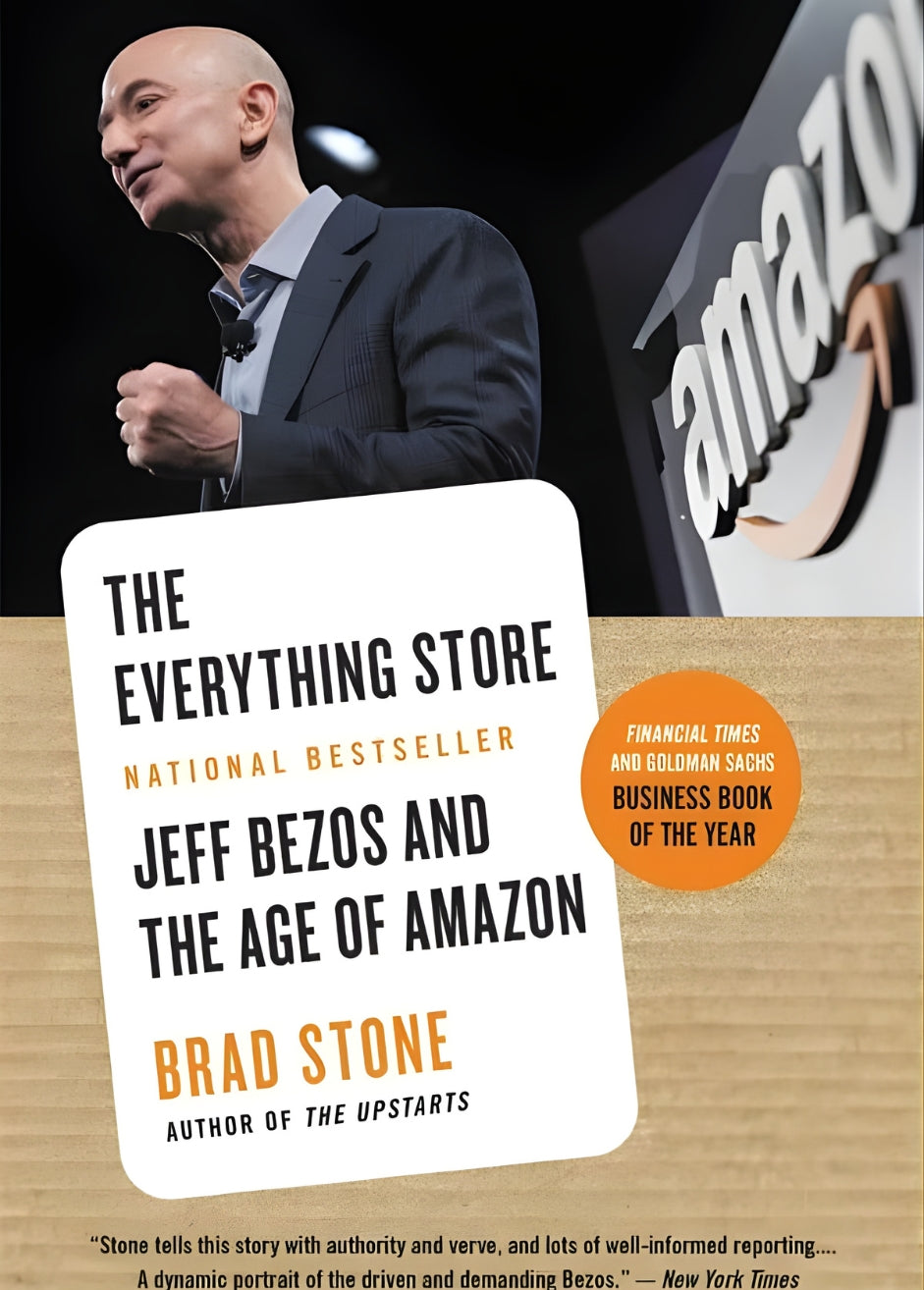 Book cover of 'The Everything Store: Jeff Bezos and the Age of Amazon' by Brad Stone with Amazon's founder on stage in the background and an accomplishment and praise badge in black and white over orange awarding it business book of the year by the financial times.