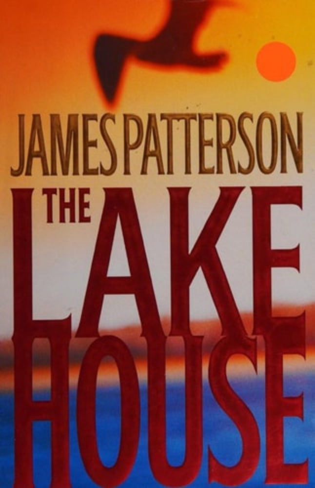This image displays the cover of "The Lake House" by James Patterson. The cover art features a striking silhouette of a house by a lake, highlighted by a dramatic orange and pink sky, possibly depicting either a sunrise or sunset.