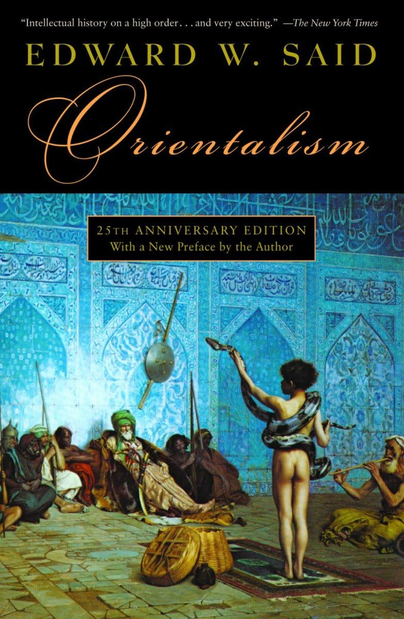Book cover of the rare out-of-print 1979 Vintage Books paperback edition of Orientalism by Edward W. Said (ISBN-13: 9780394740676, ISBN-10: 039474067X, LCCN: 79-010497). The cover art features the 1879 Orientalist oil painting The Snake Charmer (Le Charmeur de serpents) by Jean-Léon Gérôme. It depicts a nude boy seen from behind holding a large python, alongside a flute player, performing for an audience of seated armed men inside a room decorated with intricate blue Islamic tilework.