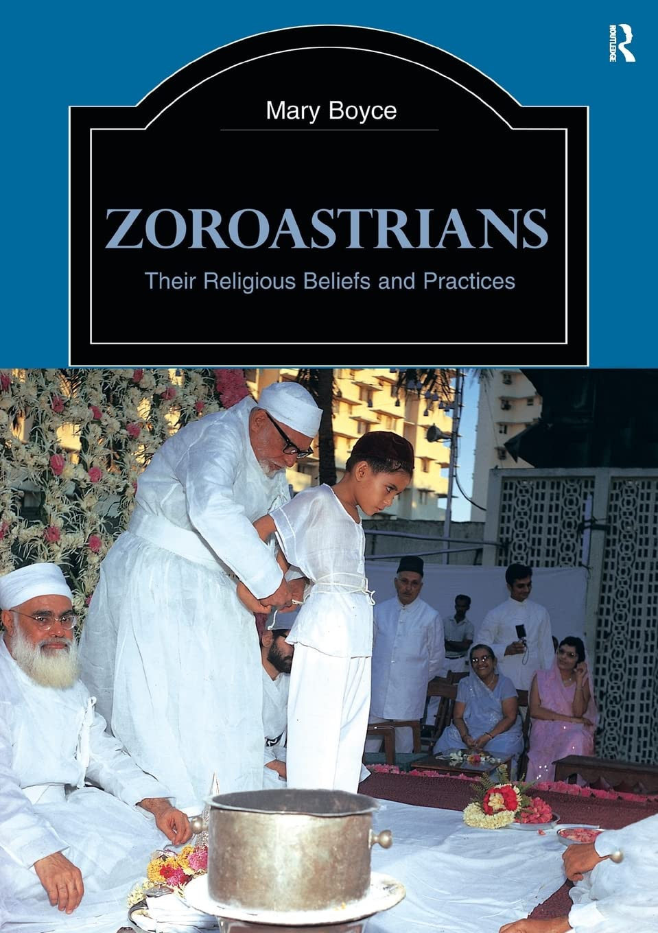 Book cover of 'Zoroastrians: Their Religious Beliefs and Practices' with a ceremony scene on a blue background.