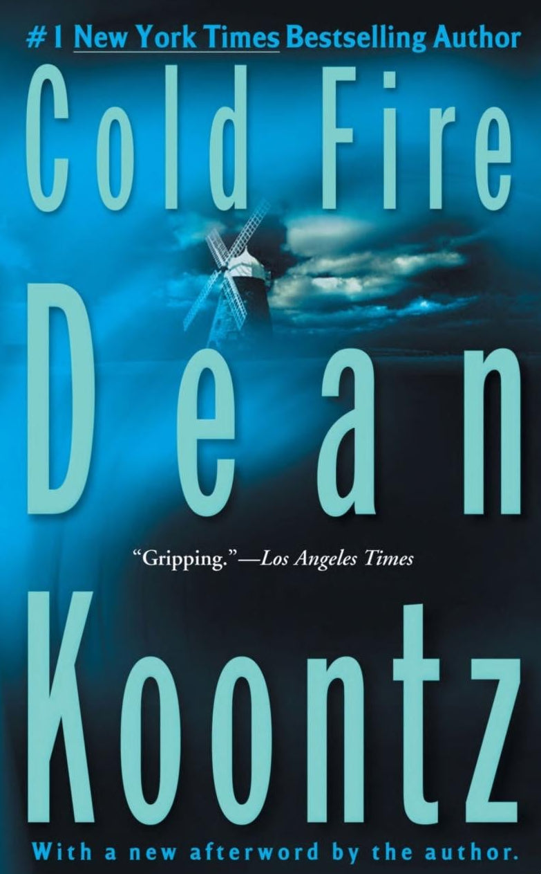 Book cover for 'Cold Fire' by Dean Koontz, featuring a dark blue stormy sky with a windmill silhouette and large light blue title and author text.
