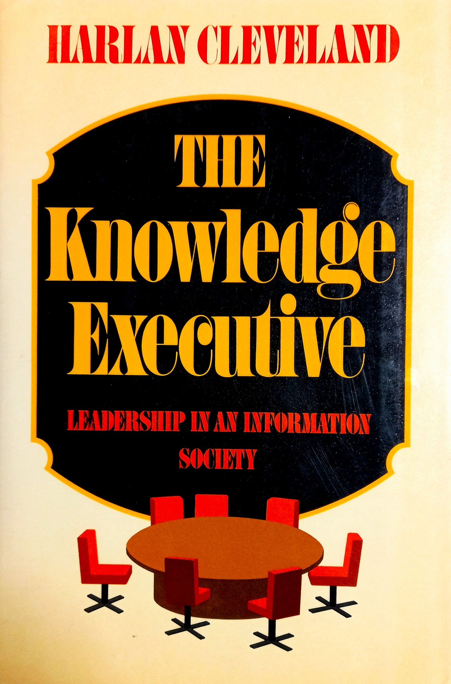 This image features the cover of "The Knowledge Executive" by Harlan Cleveland. The book's cover displays a striking design with bold, gold text that reads "THE KNOWLEDGE EXECUTIVE" in a large, elegant font, dominating the mid-center of the cover.