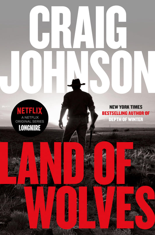 Book cover of 'Land of Wolves' by Craig Johnson with a silhouette of a man and wolf.