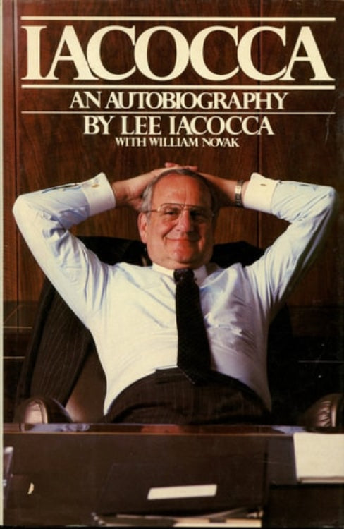 Cover of the book 'Iacocca: An Autobiography' by Lee Iacocca with William Novak, featuring a photo of Lee Iacocca sitting with his hands behind his head, wearing a suit and tie.