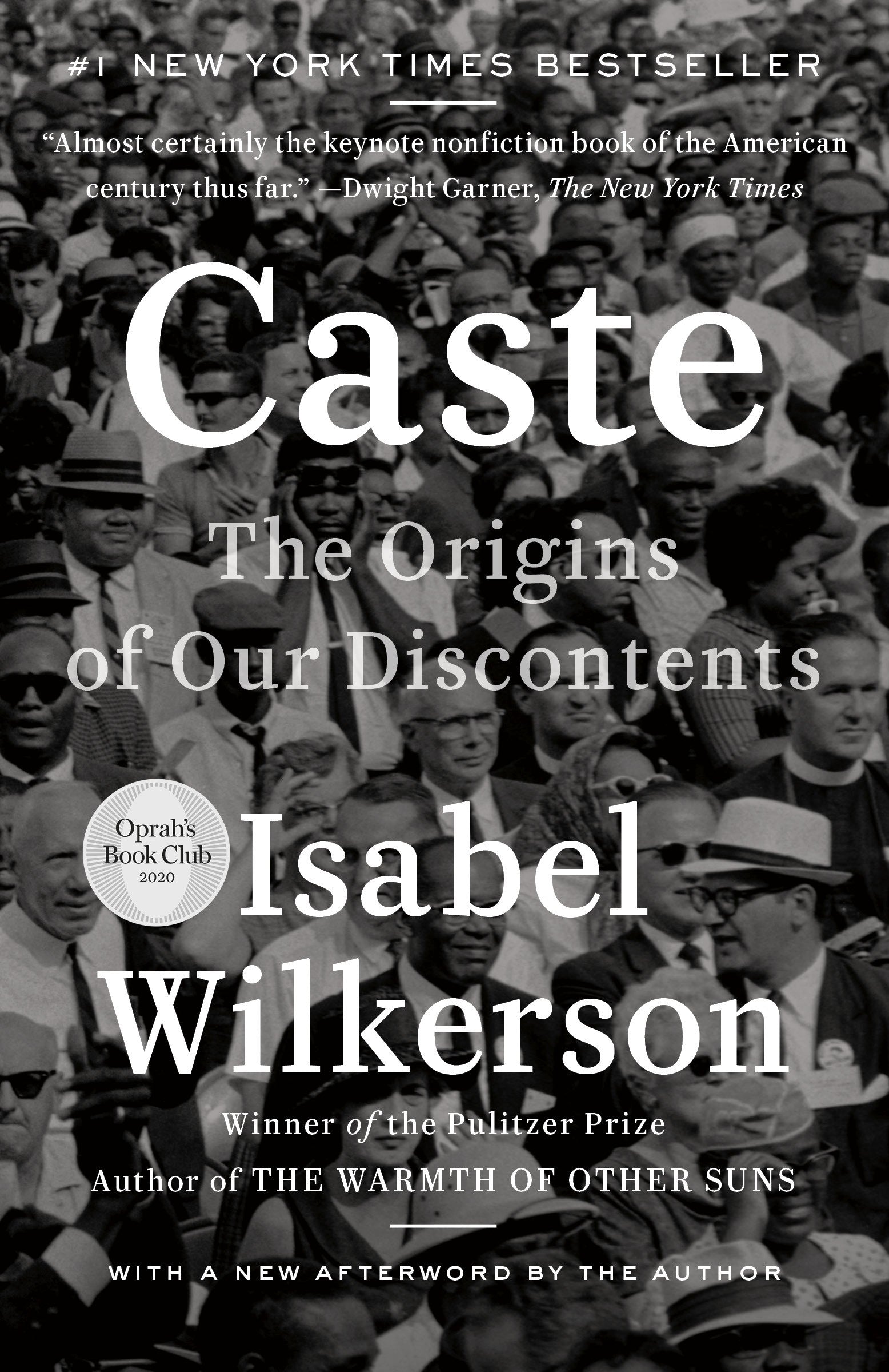 Book cover of 'Caste' by Isabel Wilkerson with a black and white photo of a crowd.
