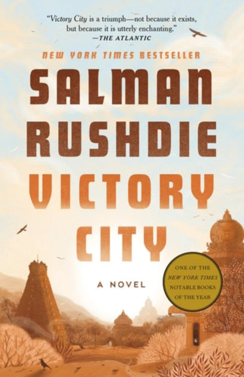 The cover of the novel 'Victory City' by Salman Rushdie features a illustration of a cityscape with a prominent building, in a desert setting with mountains in the background.