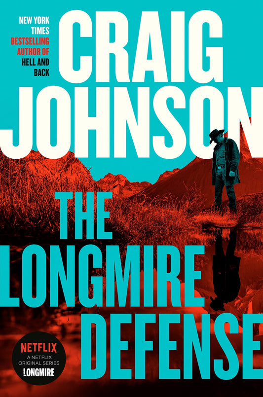Book cover of 'The Longmire Defense' by Craig Johnson with a cowboy standing in water and mountains in the background.