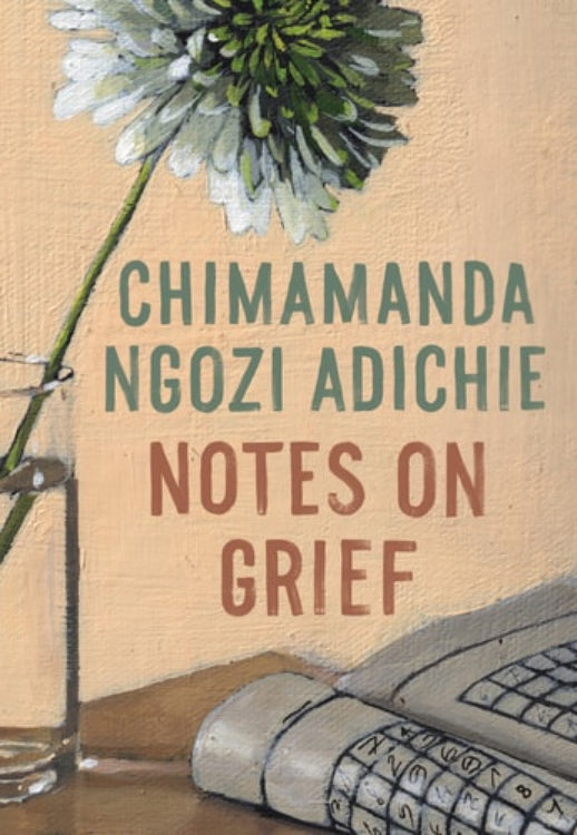 The cover of the book 'Notes on Grief' by Chimamanda Ngozi Adichie features an image of a single flower beside a computer monitor, with the title of the book displayed prominently above.
