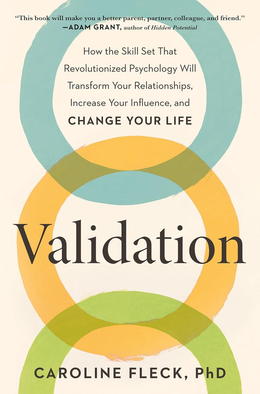 Book cover of 'Validation' by Caroline Fleck with colorful circles and text.