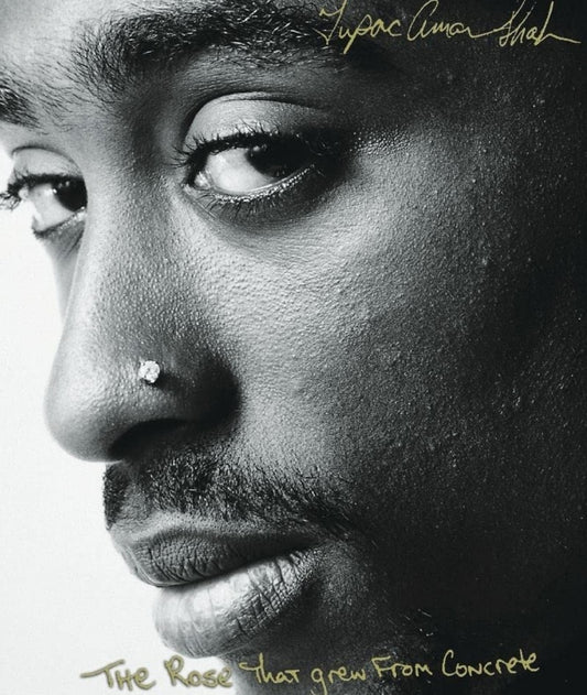 This image features the cover of "The Rose That Grew from Concrete," a poetry collection by Tupac Amaru Shakur. The cover is strikingly simple yet powerful, with a close-up black and white photograph of Tupac's face, capturing his intense and thoughtful expression.