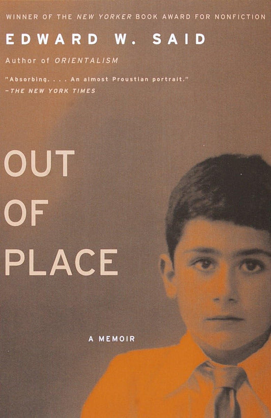 The cover of the book 'Out Of Place: A Memoir' by Edward W. Said, featuring a portrait of the author in his youth, with a neutral color scheme and text details.