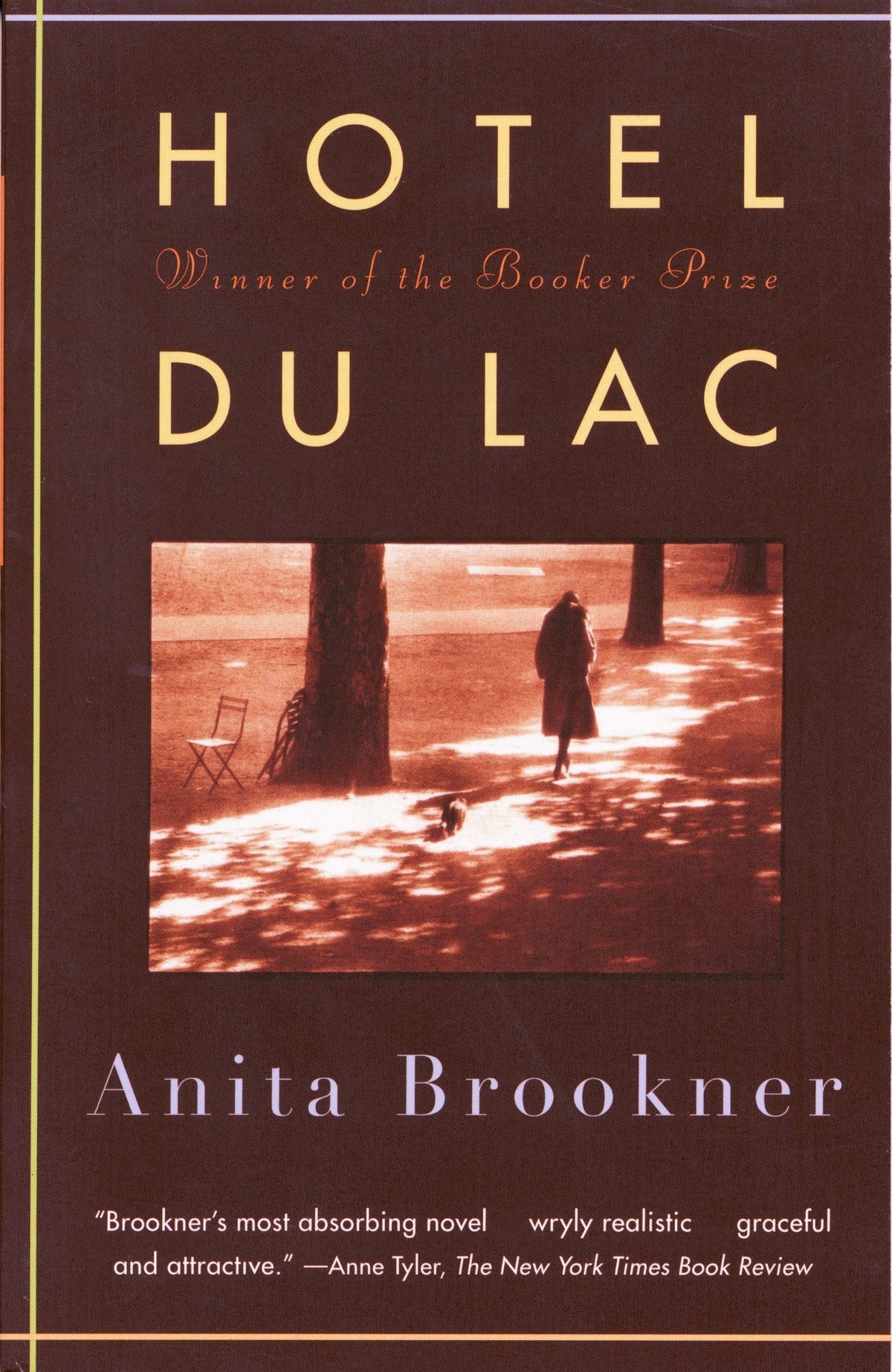 Book cover of 'Hotel du Lac' by Anita Brookner, featuring a dark brown background with gold title text, a central sepia-toned photograph of a person walking in a park, and white author text at the bottom.