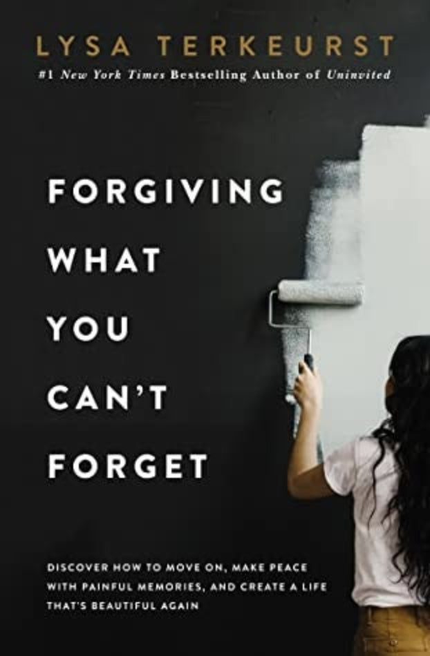 Book cover of 'Forgiving What You Can't Forget' by Lysa TerKeurst with a woman painting a wall.