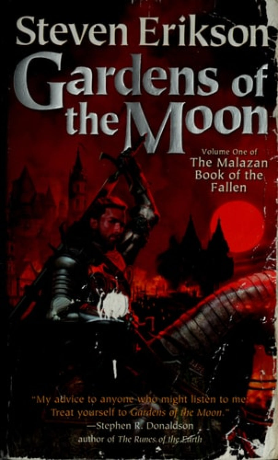 Book cover of 'Gardens of the Moon' by Steven Erikson with a warrior in armor against a red background.
