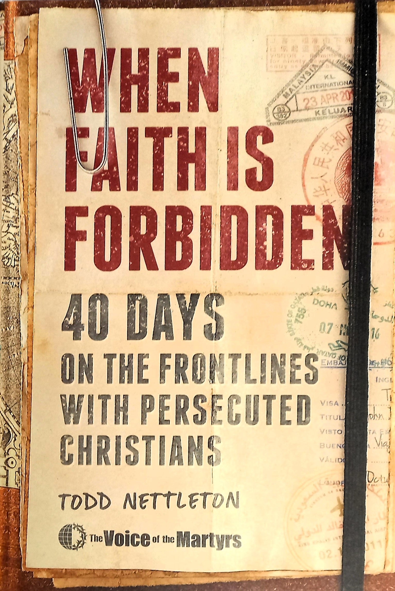The image displays the cover of the book titled "When Faith Is Forbidden: 40 Days on the Frontlines with Persecuted Christians" by Todd Nettleton and The Voice of Martyrs. The book's cover features a distinctive, rustic design with a map-like background and a black cord.