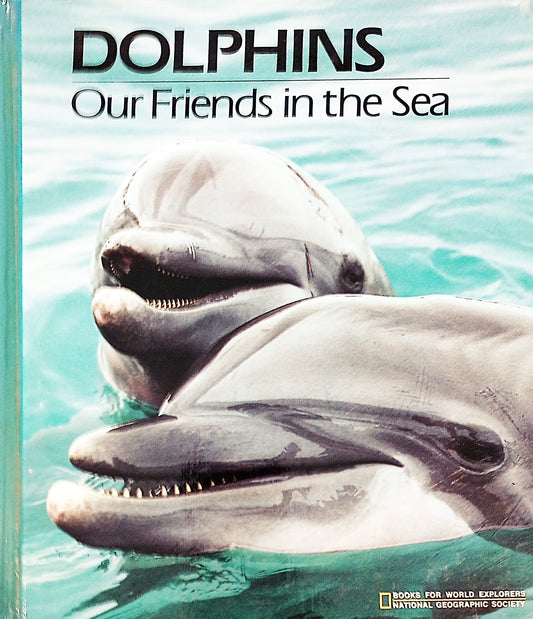 Cover of the book 'Dolphins: Our Friends in the Sea' showing photographs of dolphins in the ocean.