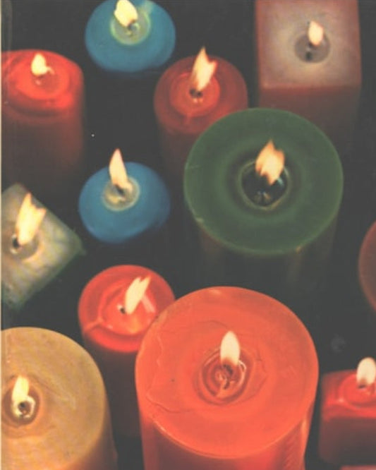 Book front cover of 'The Family Creative Workshop [Volume 3]: Boxes to Card Tricks' featuring collection of colorful candles with a bright flame, arranged closely together.