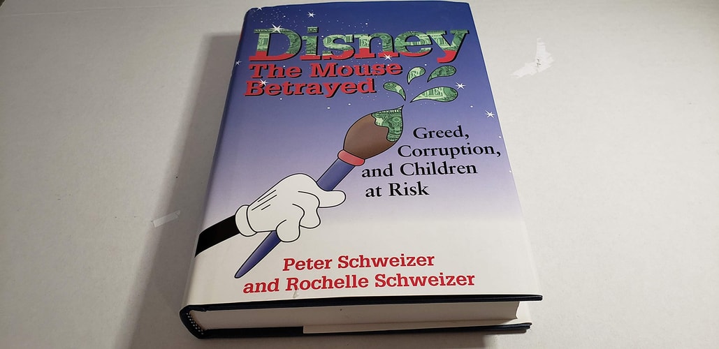 Book titled 'Disney: The Mouse Betrayed' by Peter Schweizer and Rochelle Schweizer on a white background