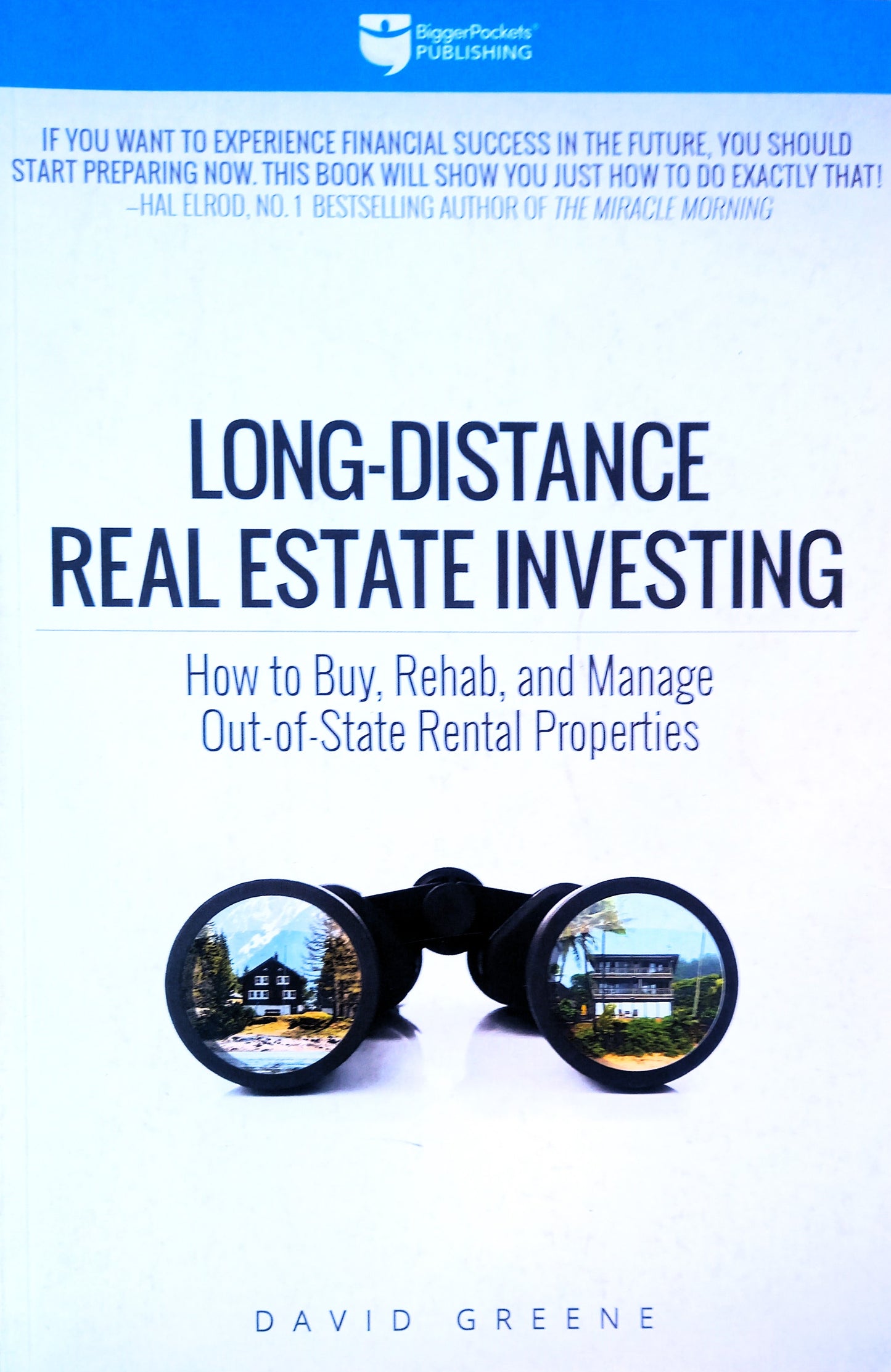 Book cover of 'Long-Distance Real Estate Investing' by David Greene, featuring a title and author's name, with a metaphorical image of binoculars and a house in the background.