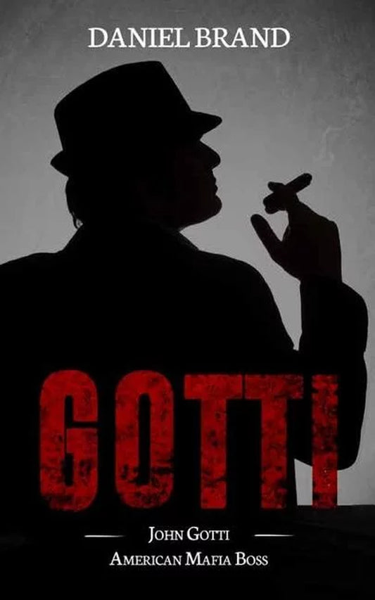 Book cover of 'John Gotti: American Mafia Boss' by Daniel Brand featuring a stylized image of John Gotti in a hat and coat, with the title and author's name in red and black text.