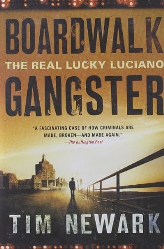 Book cover for 'Boardwalk: The Real Lucky Luciano Gangster' by Tim Newark, featuring large black title text over a sepia-toned boardwalk scene with a silhouetted figure and buildings.