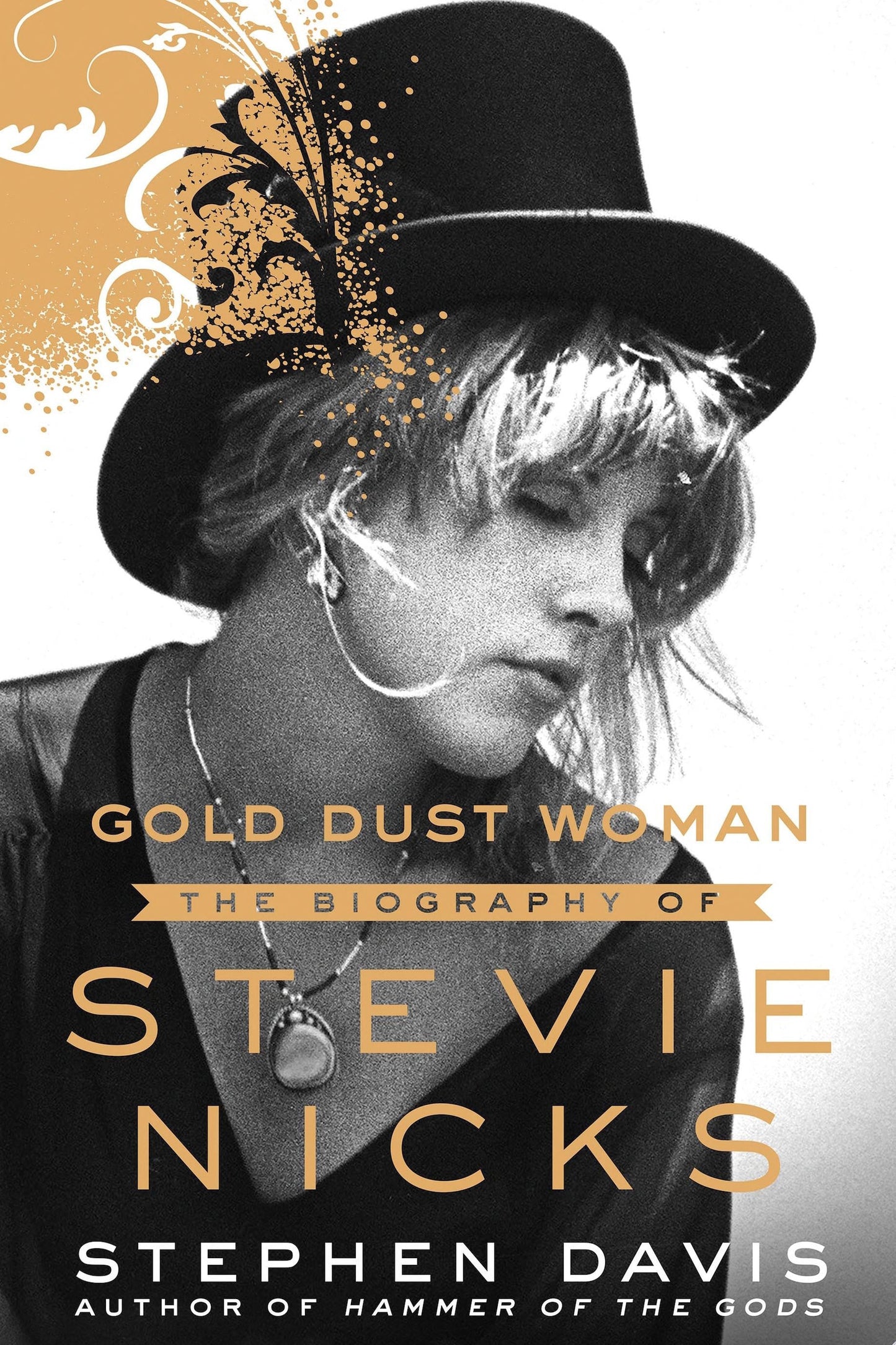 Book cover of 'Gold Dust Woman: The Biography of Stevie Nicks' with a black and white photo of Stevie Nicks wearing a top hat.
