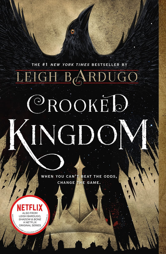 Book cover of 'Crooked Kingdom' by Leigh Bardugo with a crow and castle silhouette.