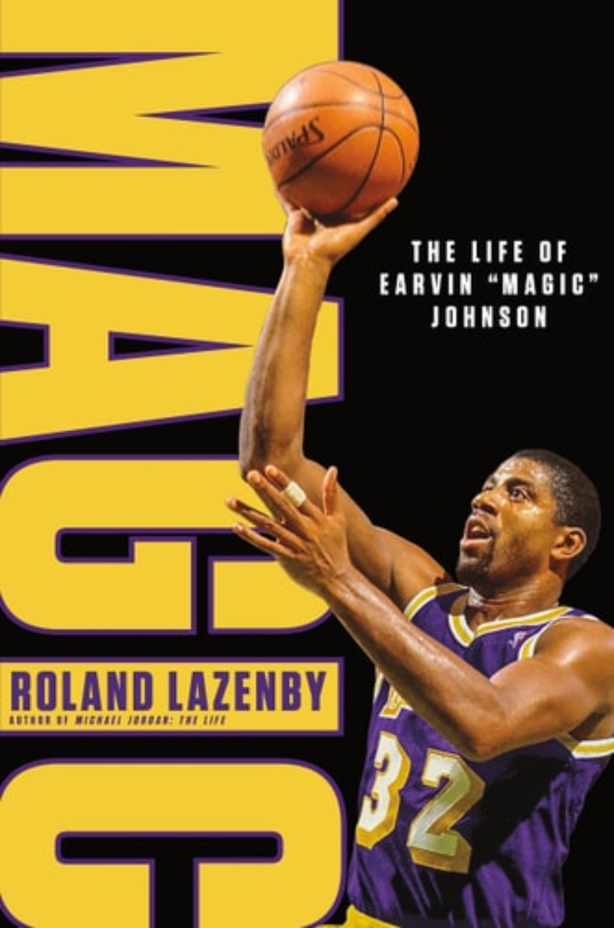 Book cover of 'Magic: The Life of Earvin "Magic" Johnson' by Roland Lazenby featuring a basketball player Earvin Magic Johnson in a purple and gold LA Lakers jersey with the number 32 at point guard.