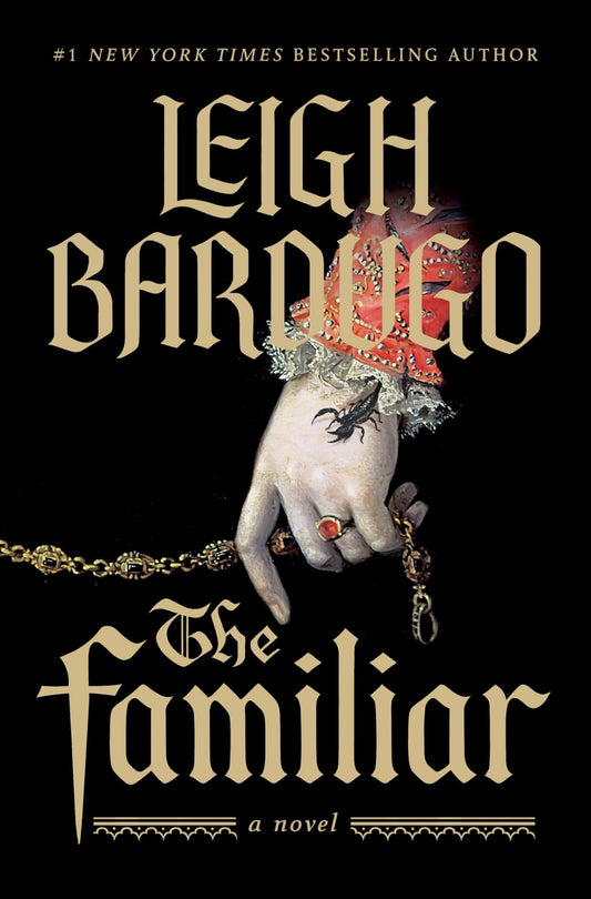 Book cover of 'The Familiar' by Leigh Bardugo with a hand holding a small creature and ornate text.