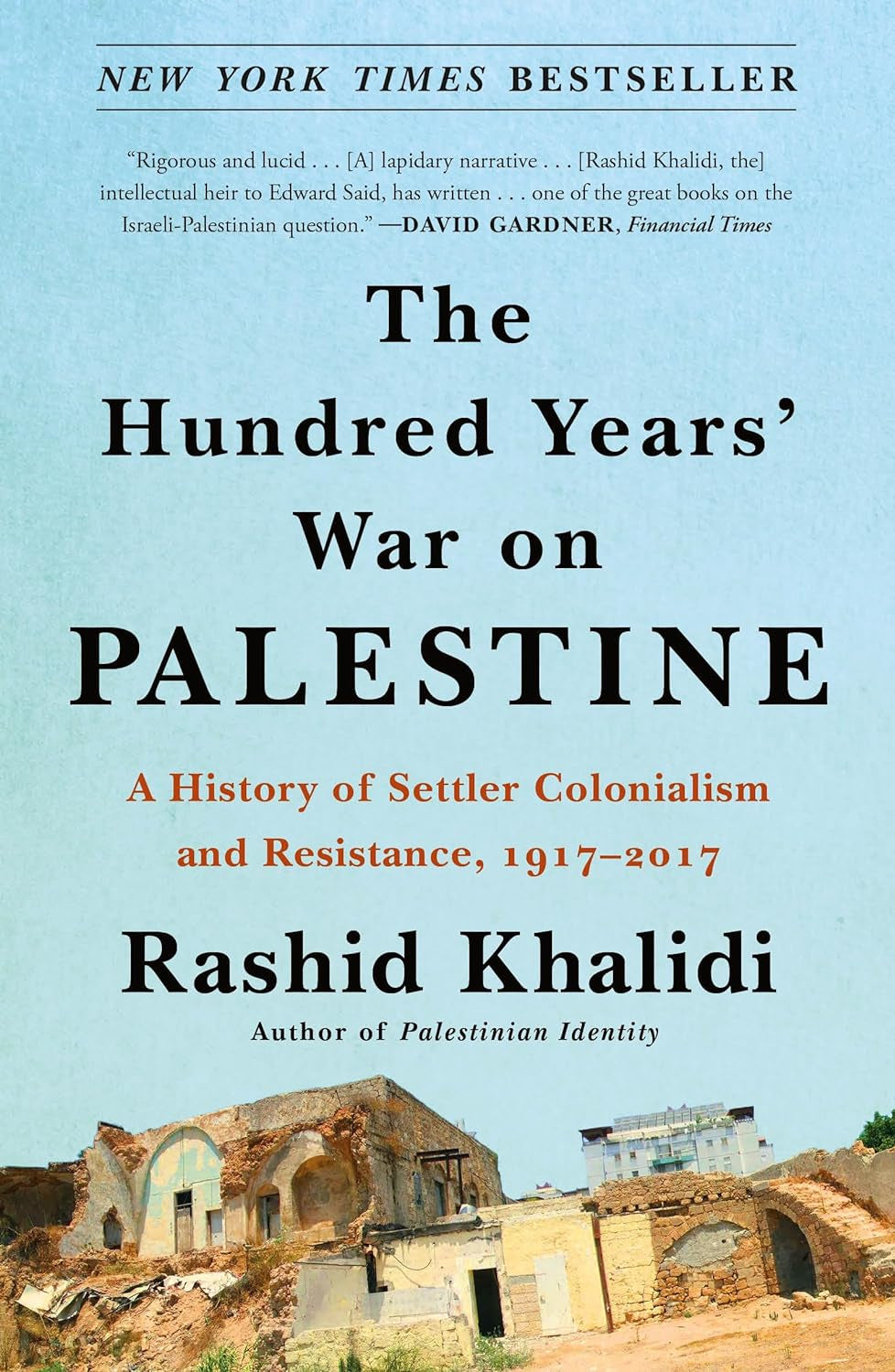 The cover of the book 'The Hundred Years' War on Palestine' by Rashid Khalidi features a photograph of an old, ruined building with a clear blue sky in the background.