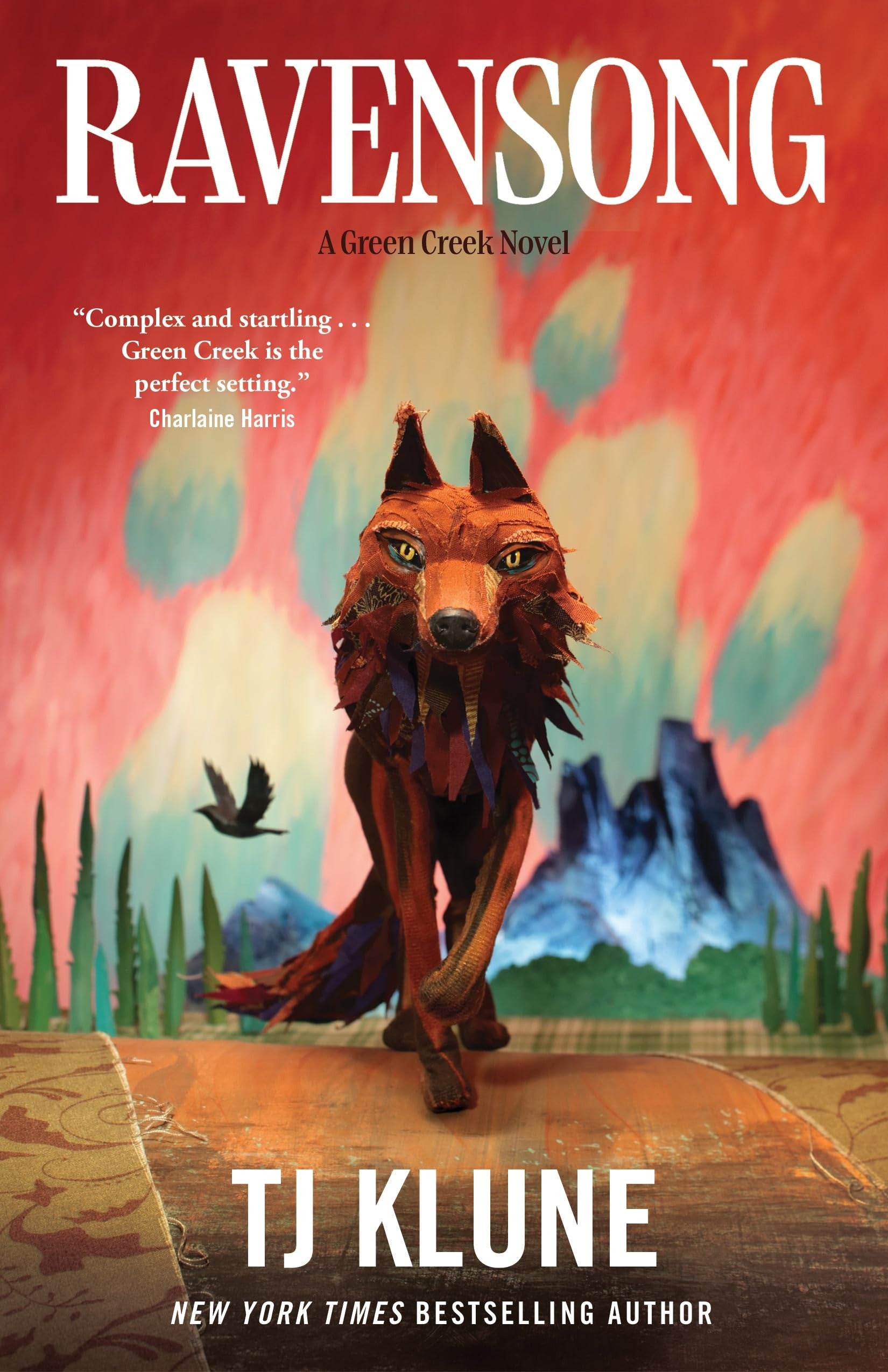 Book cover of 'Ravensong' by TJ Klune featuring a fox-like creature and mountain landscape.