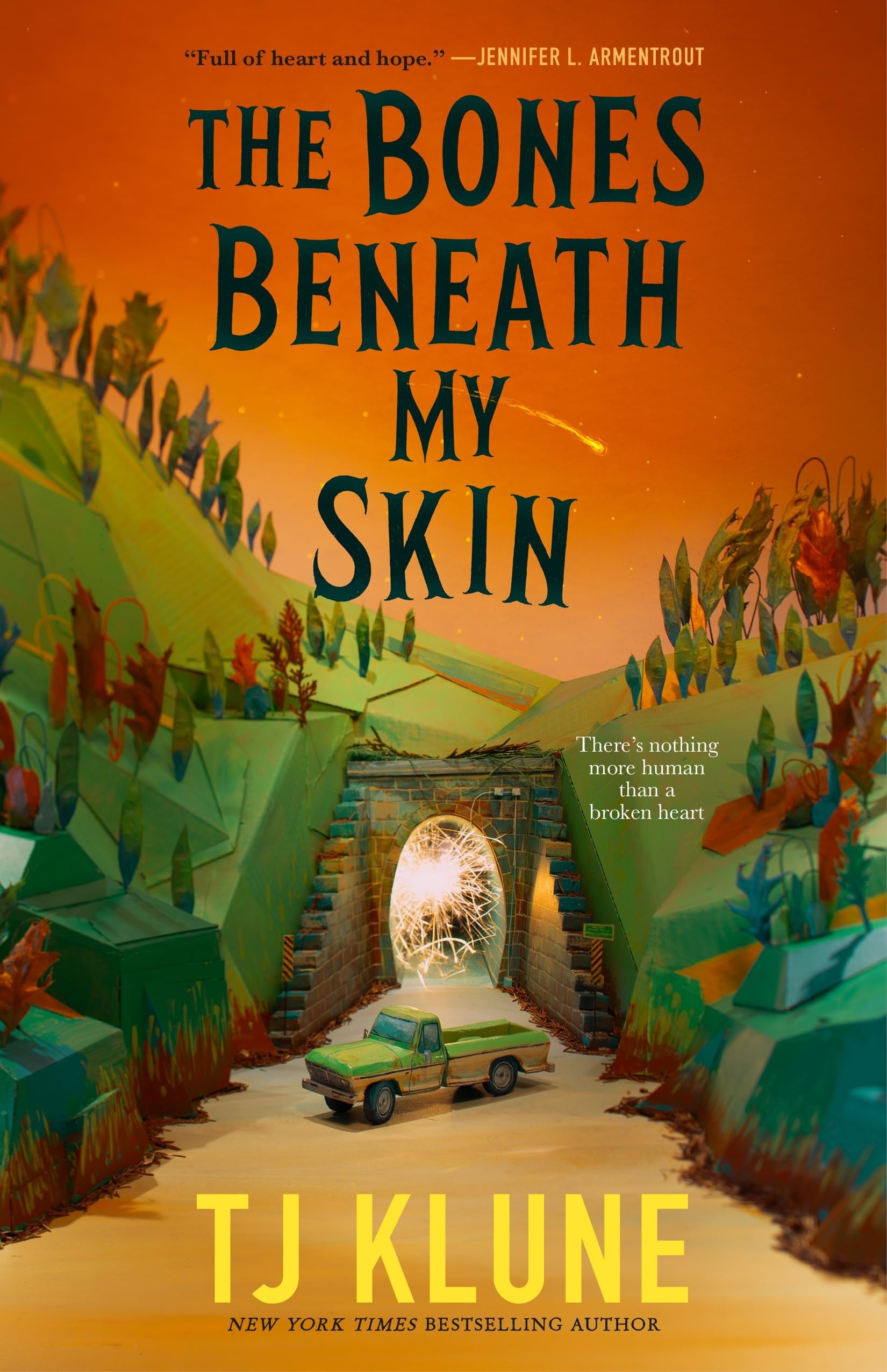Book cover of 'The Bones Beneath My Skin' by TJ Klune with a colorful illustration of a tunnel and people.