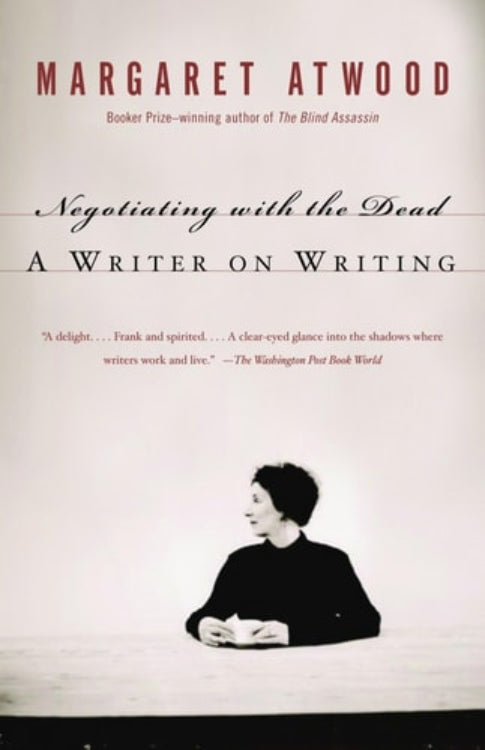 The cover of the book 'Negotiating with the Dead: A Writer on Writing' by Margaret Atwood, featuring a black and white photo of Margaret Atwood seated.