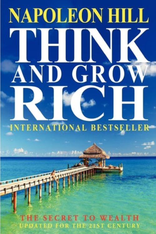 Book cover of 'Think and Grow Rich' by Napoleon Hill with a beach scene in the background