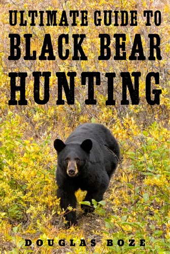 Book cover of 'Ultimate Guide to Black Bear Hunting' with a black bear in a forest.