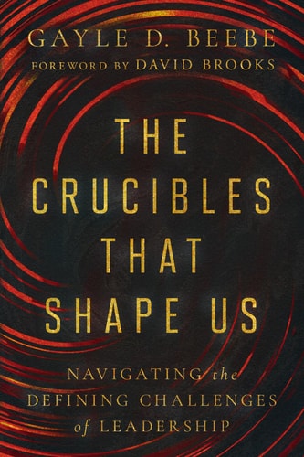 Book cover for 'The Crucibles That Shape Us' by Gayle D. Beebe, featuring text title on a background with red and black spiral patterns.